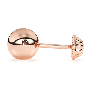 Round stud earrings in rose gold with screwback post.