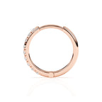 Rose gold huggie hoop with pave set clear CZ stone.