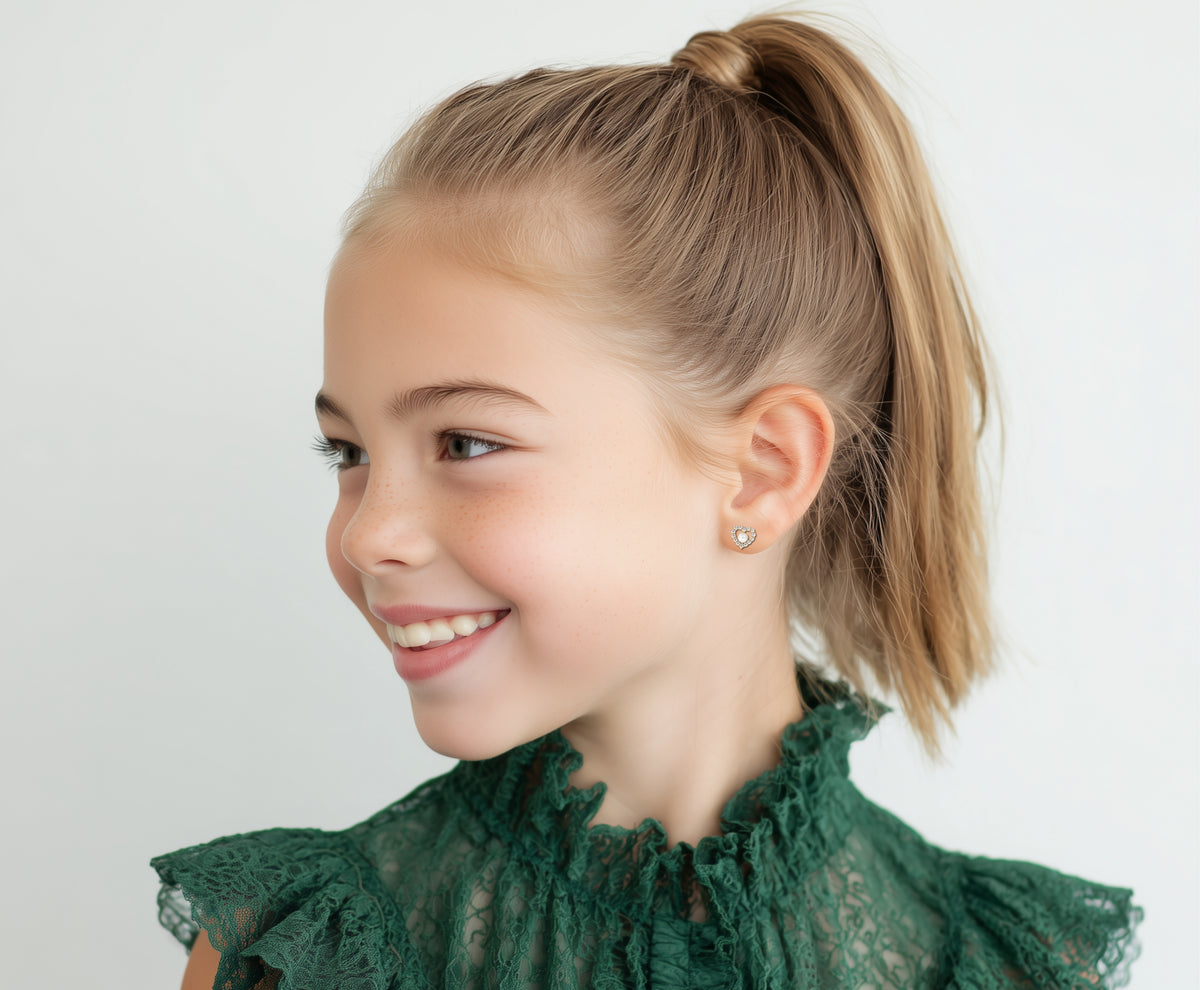 Child wearing All My Love, Pearl and Clear Pavé CZ Stud Earrings in Yellow Gold with screwback post.