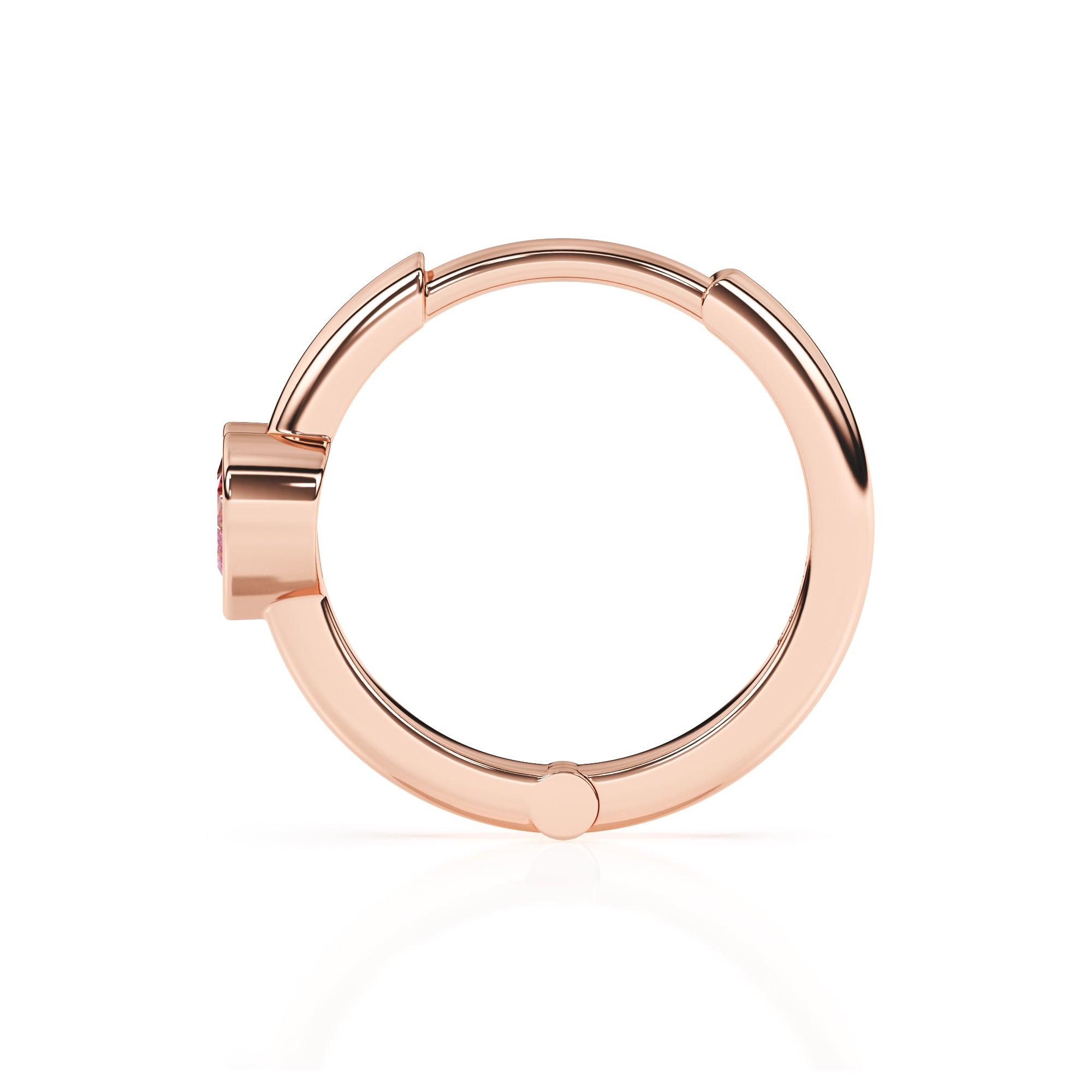 Rose gold huggie hoop earrings with a pink heart shaped stone.