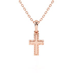 Rose gold cross necklace on a white background.