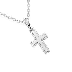 White gold cross necklace on a white background.