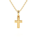 Yellow gold cross necklace on white background.