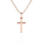 Rose gold cross necklace on a white background.