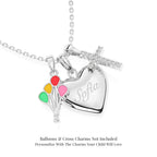 Sterling silver necklace with heart locket pendant, colorful balloon, and pave cross  charms on a white background.