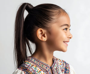 Child wearing Miss Mouse with Bow, Clear Round CZ Stud Earrings in Yellow Gold with screwback post.