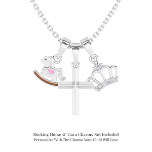 Sterling silver necklace with cross pendant, rocking horse, and tiara charms on a white background.