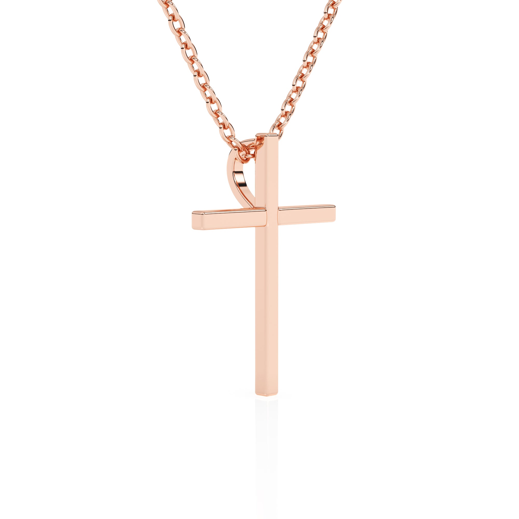 Rose gold cross necklace on a white background. 