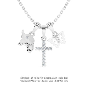Sterling silver necklace with clear CZ pave cross pendant. butterfly, and elephant charms on a white background.