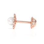 Rose gold stud earrings with screwback post and flower shape with a pearl in the center.