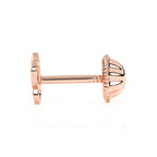 Young girl wearing butterfly stud earrings in rose gold with screwback post. 