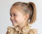 Child wearing Lucky Ladybug, Pink Stud Earrings in Yellow Gold with screwback post.