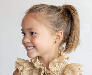 Child wearing Lucky Ladybug, Pink Stud Earrings in Yellow Gold with screwback post.