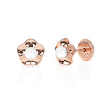 Rose gold earrings with screwback post and a ruffled flower petal with a pearl in the center. 