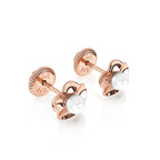 Rose gold earrings with screwback post and a ruffled flower petal with a pearl in the center. 