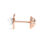 Rose gold earrings with screwback post and a ruffled flower petal with a pearl in the center. 