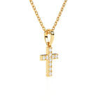 Gold cross necklace with CZ stones on a white background.