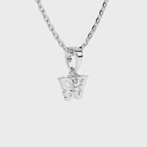 Sterling silver butterfly pendant necklace on a white background video.