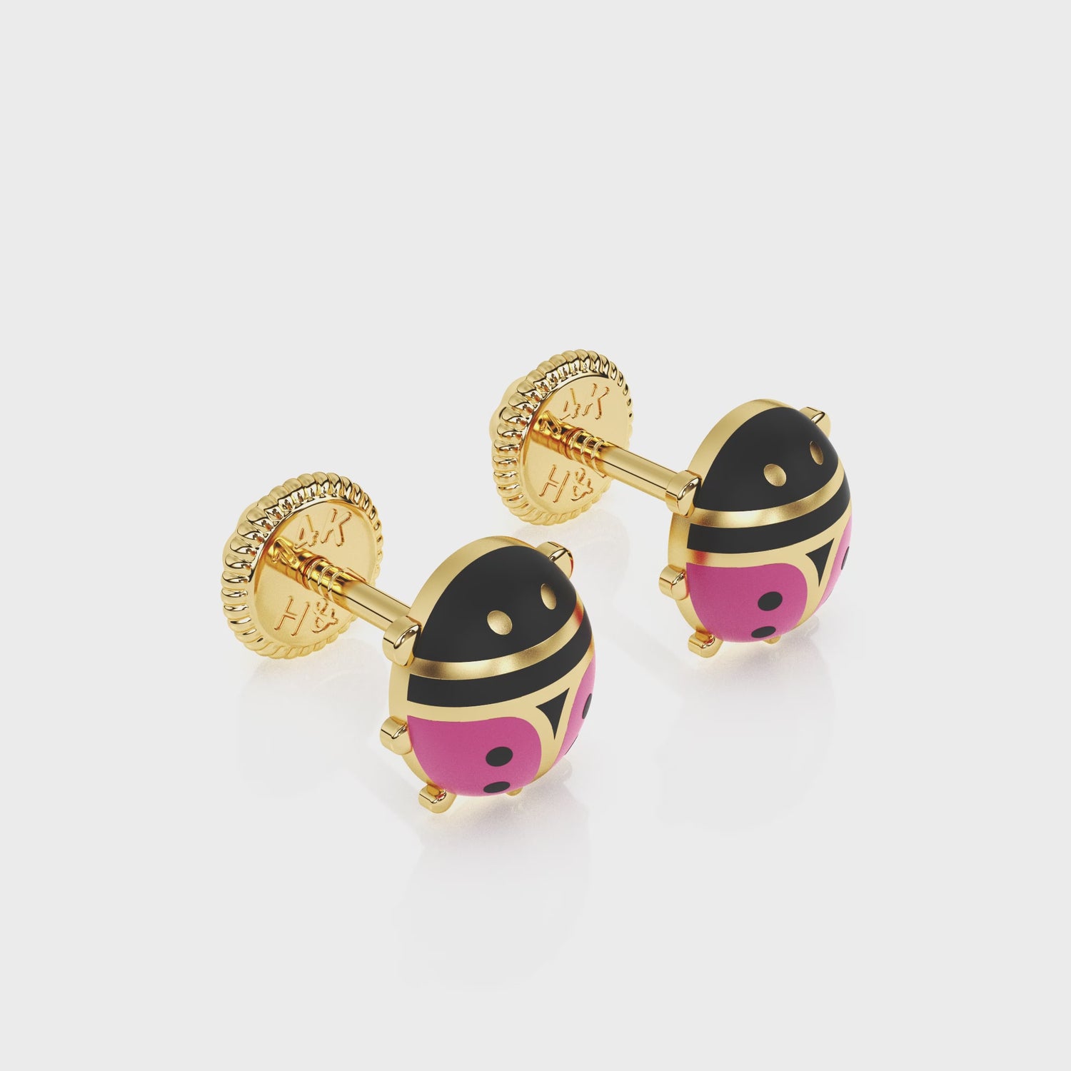 360-degree video of Lucky Ladybug pink stud earrings in solid 14K yellow gold with screw-back posts.