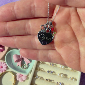 Classic Heart Sterling Silver personalized, engravable necklace pendant held in hand to show its actual size.