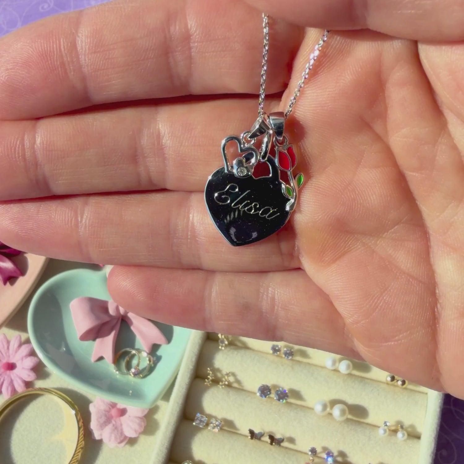 Classic Heart Sterling Silver personalized, engravable necklace pendant held in hand to show its actual size.