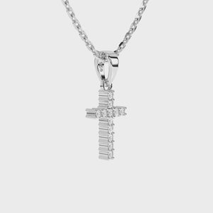 Sterling silver cross pendant with clear pave set CZ necklace on a white background video.