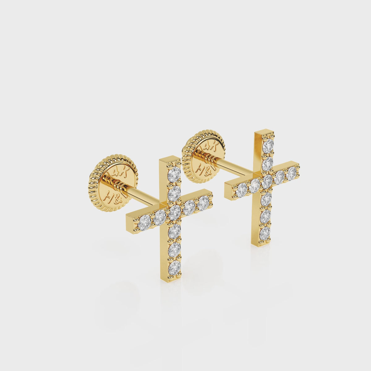 360-degree video of Faithful Cross clear pavé CZ stud earrings in solid 14K yellow gold with screw-back posts.