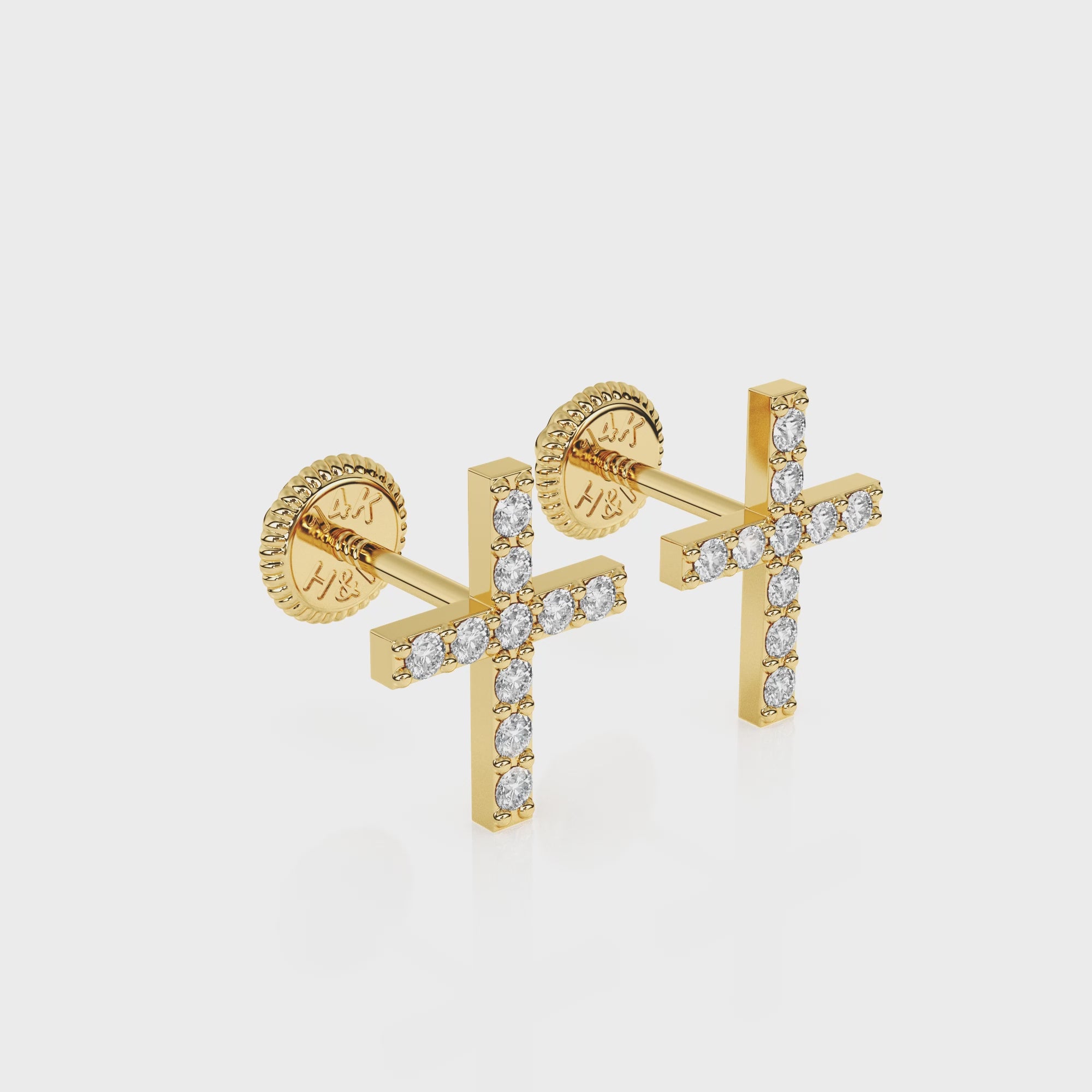 360-degree video of Faithful Cross clear pavé CZ stud earrings in solid 14K yellow gold with screw-back posts.