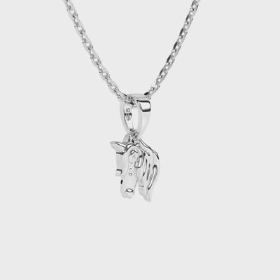 Sterling silver unicorn pendant necklace on a white background video.