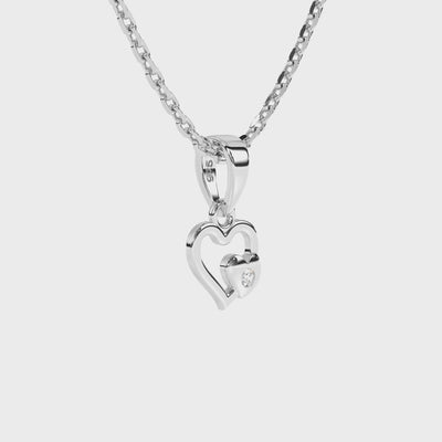 Sterling silver heart-shaped pendant with clear CZ stone on a necklace with a white background video.