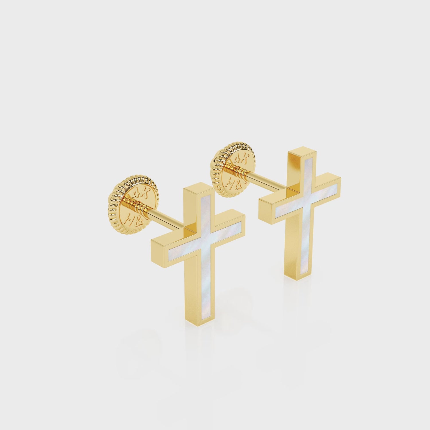 360-degree video of Genuine Faith mother of pearl cross stud earrings in solid 14K yellow gold with screw-back posts.