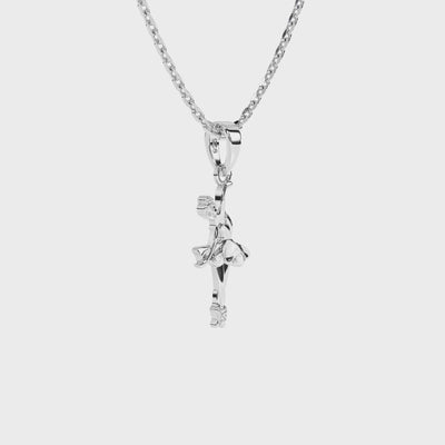 Sterling silver ballerina pendant with clear CZ stones on a necklace chain against a white background video.