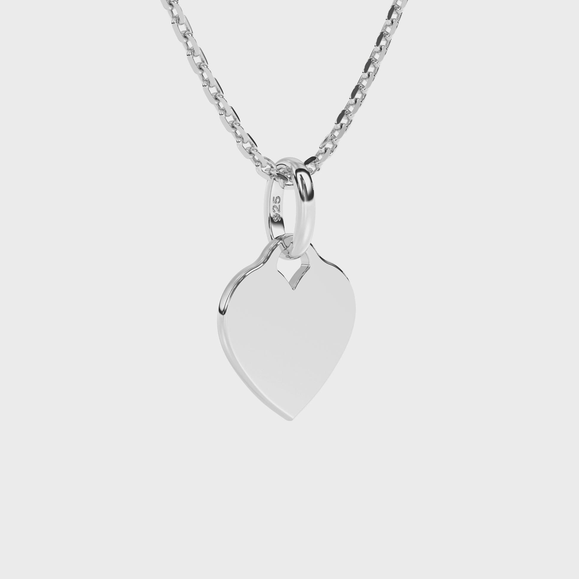 Sterling Silver necklace with heart-shaped pendant on a white background.