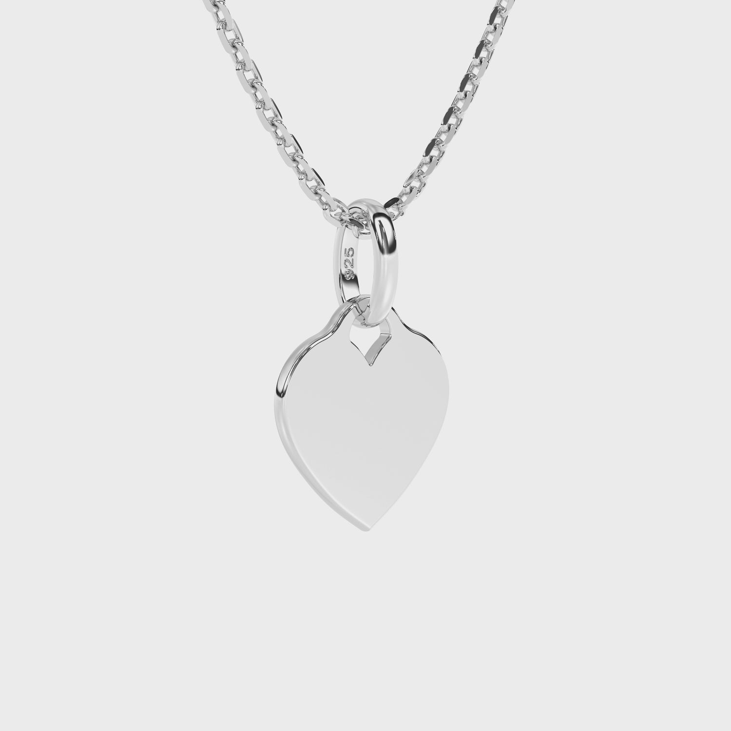 Sterling Silver necklace with heart-shaped pendant on a white background.